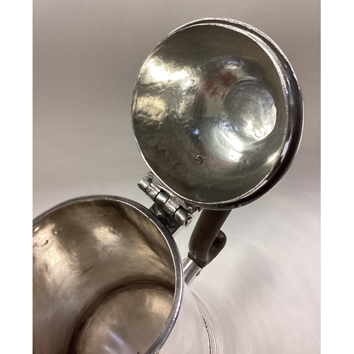 460 - A rare George I silver side-handled chocolate pot with central armorial. London 1727. By Hugh Arnett... 