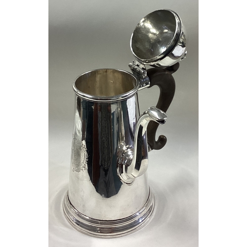 460 - A rare George I silver side-handled chocolate pot with central armorial. London 1727. By Hugh Arnett... 