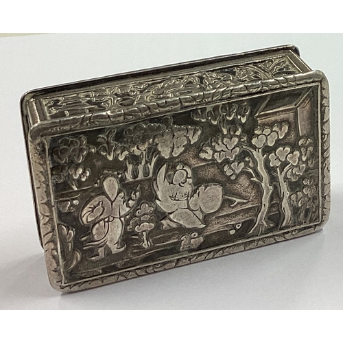 466 - A Chinese silver box with figural decoration. Marked KHC. Approx. 90 grams. Est. £80 - £120.