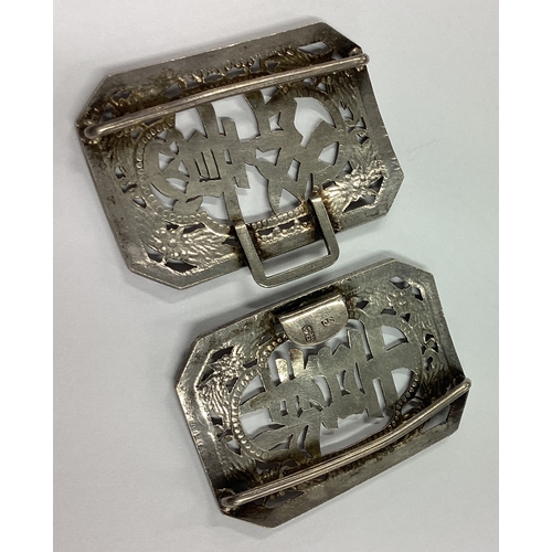 482 - A Chinese export silver buckle pierced with flowers and Chinese writing. Marked Sunshing. Approx. 46... 