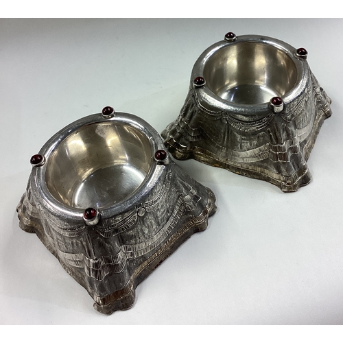 484 - A large and fine pair of silver bowls with carved chasing and applied red stones. London 1989. By Ri... 