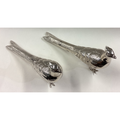 488 - A pair of silver pepperettes in the form of pheasants with screw-top covers. Marked to bases. Approx... 