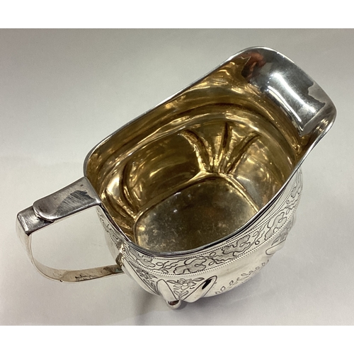 492 - An 18th Century Georgian silver cream jug with fine bright-cut decoration. Approx. 153 grams. Est. £... 