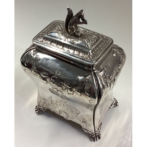 493 - A fine Georgian silver tea caddy cast with squirrel finial. London 1765. By Pierre Gillois. Approx. ... 