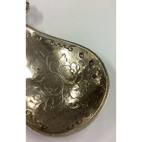 495 - A Victorian silver caddy spoon cast with figural decoration to handle bearing import marks. Approx. ... 