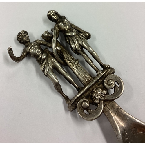 495 - A Victorian silver caddy spoon cast with figural decoration to handle bearing import marks. Approx. ... 