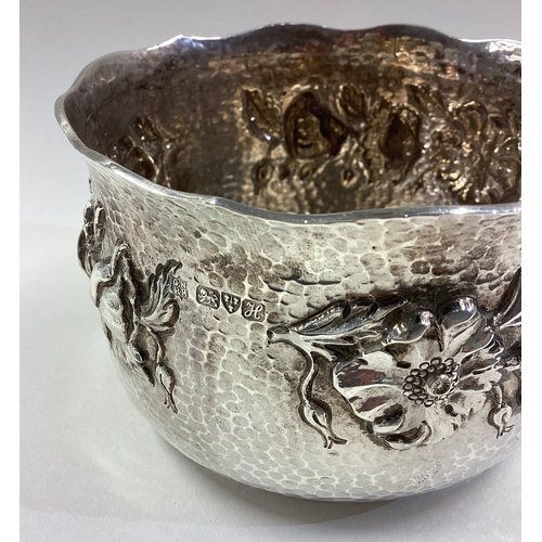 499 - CHESTER: A fine Art Nouveau chased silver bowl embossed with floral decoration. 1908. By George Nath... 