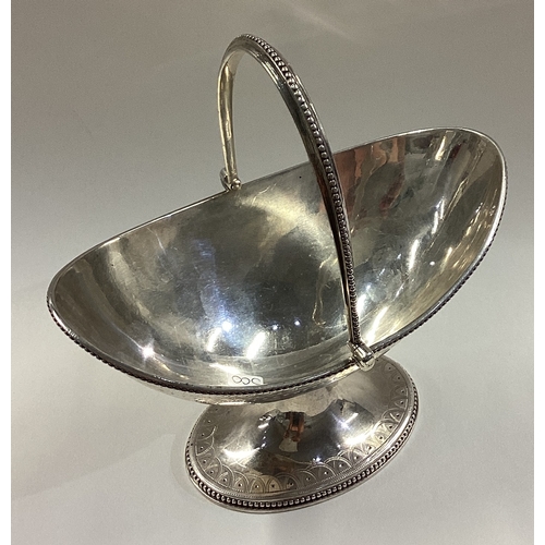 500 - A heavy Victorian silver swing handled basket with swag decoration. London 1874. By Robert Hennell. ... 