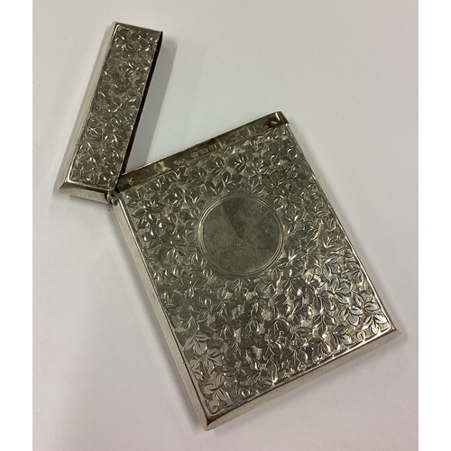 501 - A fine silver card case chased with leaves. Birmingham 1908. By Smith & Bartlam. Approx. 54 grams. E... 