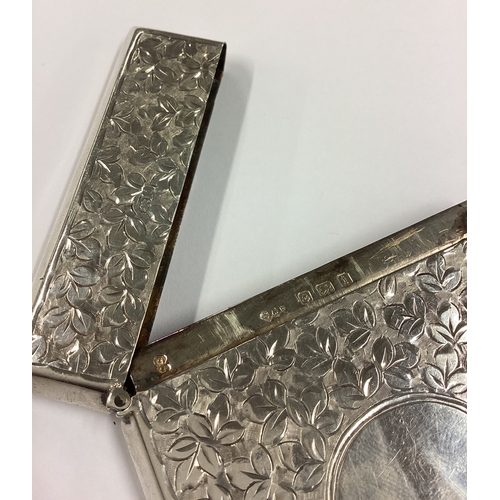 501 - A fine silver card case chased with leaves. Birmingham 1908. By Smith & Bartlam. Approx. 54 grams. E... 