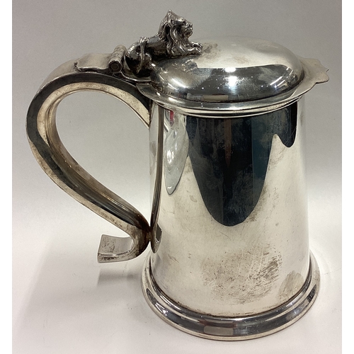 505 - A fine silver lidded beer tankard with hinged lid cast with lion. Fully marked to base and part mark... 