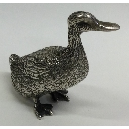 517 - A heavy textured silver figure of a duck in standing position. Approx. 154 grams. Est. £80 - £120.