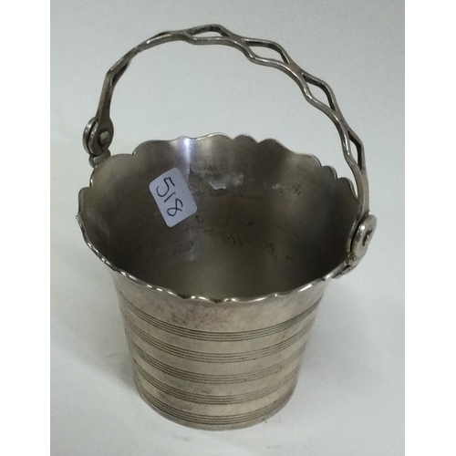 518 - A small Georgian style silver cream pail of shaped form. London. Approx. 68 grams. Est. £40 - £60.