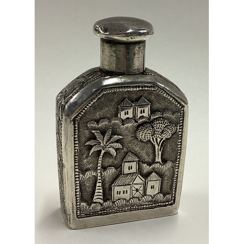 522 - A chased Indian silver flask with screw-top lid. Approx. 82 grams. Est. £80 - £120.