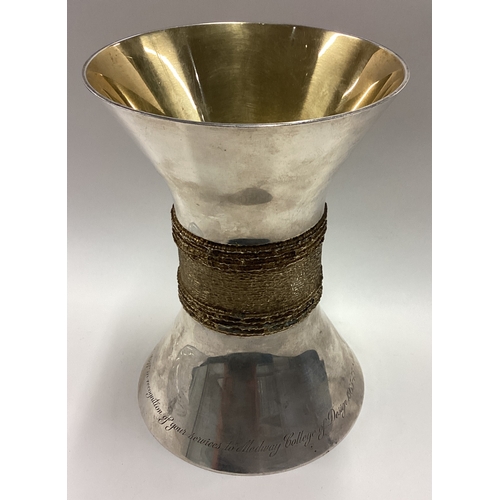 525 - A large silver double goblet with gilt hammered decoration. London 1974. By MCA. Approx. 650 grams. ... 