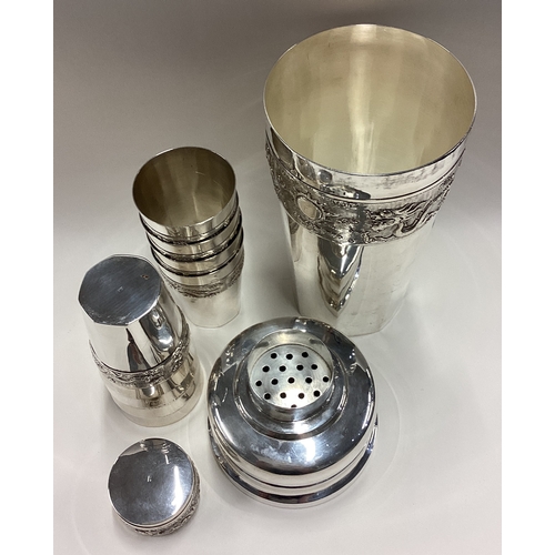 527 - A large Chinese silver cocktail shaker with eight beakers. Approx. 600 grams. Est. £500 - £800.