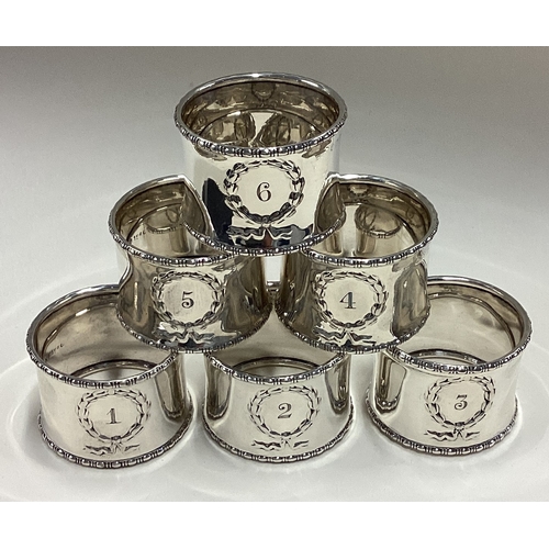 528 - A set of six numbered silver napkin rings. Birmingham 1909. Approx. 120 grams. Est. £300 - £400.