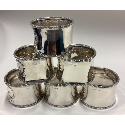 528 - A set of six numbered silver napkin rings. Birmingham 1909. Approx. 120 grams. Est. £300 - £400.