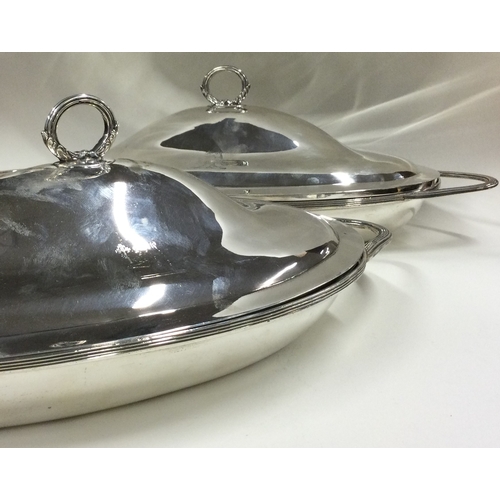 530 - A fine pair of 18th Century silver entrée dishes and covers. London 1795. By Henry Chawner. Approx. ... 