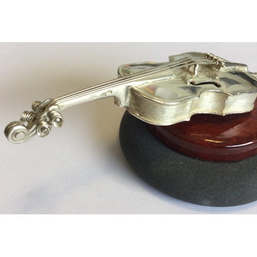 536 - A silver model of a cello. Marked 925. Approx. 80 grams. Est. £50 - £80.