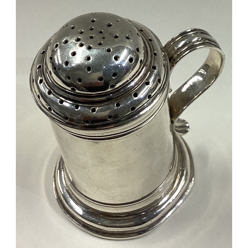 54 - CHARLES STUART HARRIS: An early style Britannia Standard silver kitchen pepper. Approx. 88 grams. Es... 