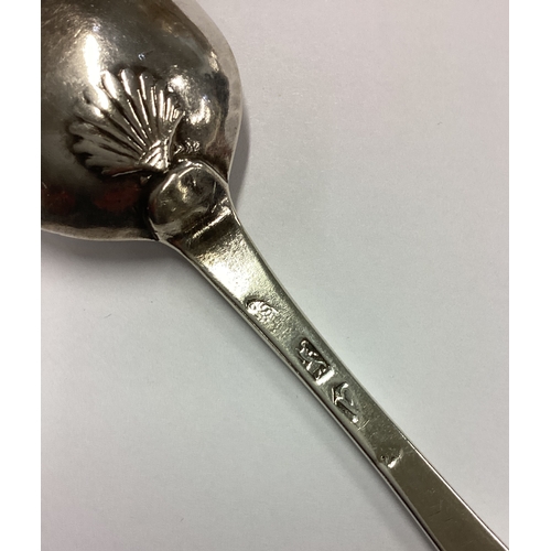 551 - An early 18th Century silver bottom marked spoon with shell back. London 1736. By Samuel Hutton. App... 