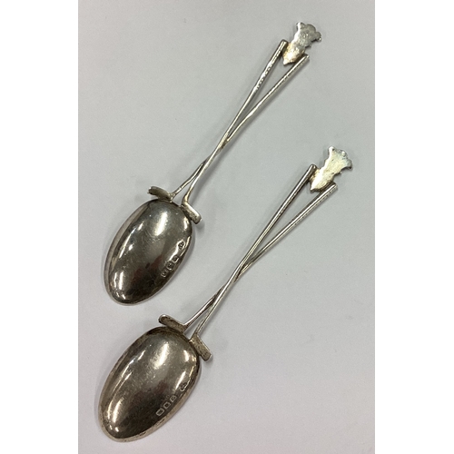 553 - OF GOLFING INTEREST: A pair of rare novelty silver spoons with Royal crest to centre. London 1929. A... 