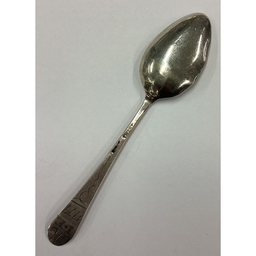 560 - An 18th Century silver spoon. Inscribed 1777. Approx. 4 grams. Est. £20 - £30.