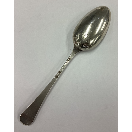 561 - An 18th Century silver shell back spoon with rat tail front. Circa 1730. By Richard Pargeter. Approx... 