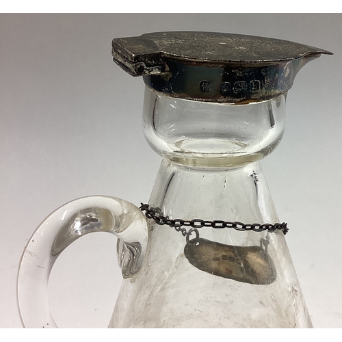 60 - A silver and glass whisky noggin with label. Birmingham 1907. Approx. 147 grams of gross weight. Est... 