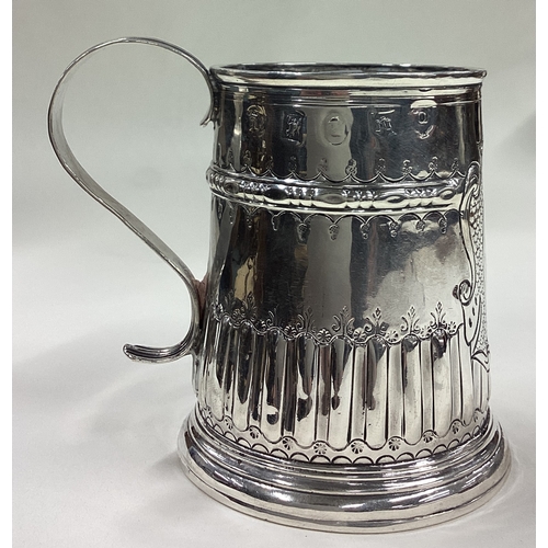 601 - EXETER: A rare early 18th Century Queen Anne silver mug of fluted form. 1716. By John Elston. Approx... 