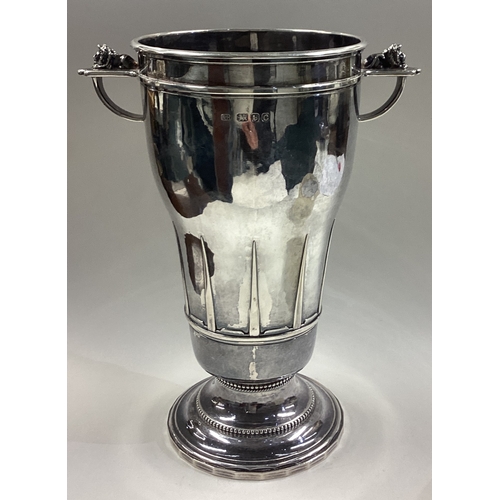 62 - GUILD OF HANDICRAFTS: A rare silver two-handled trophy cup. London 1938. Approx. 944 grams. Est. £10... 