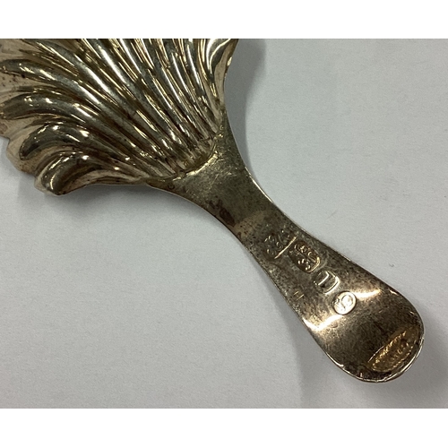 626 - A fluted Victorian silver caddy spoon with bright-cut decoration. London 1860. Approx. 5 grams. Est.... 