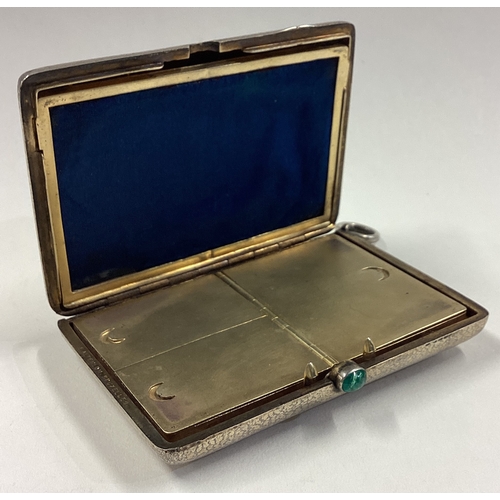 65 - A fine early 20th Century silver combination cigarette case / compact with green stone pusher. Circa... 