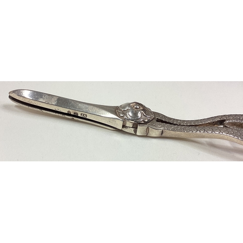 653 - A cased pair of late Victorian silver grape scissors. Birmingham. Approx. 74 grams. Est. £100 - £150... 