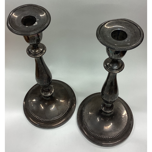 660 - A fine and rare pair of George III silver candlesticks bearing rare double duty mark. Sheffield 1797... 