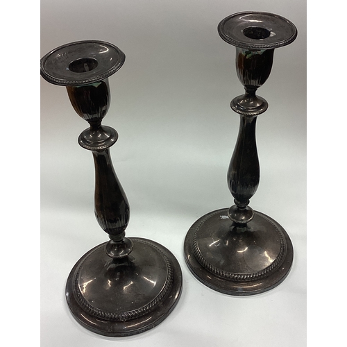 660 - A fine and rare pair of George III silver candlesticks bearing rare double duty mark. Sheffield 1797... 