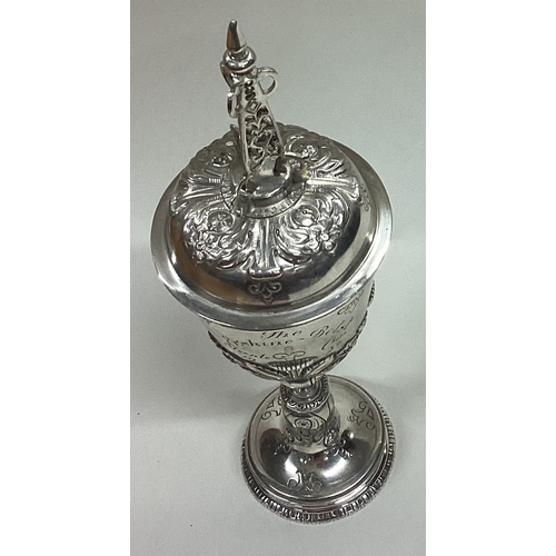 661 - An early style silver goblet and cover. Marked to body. London 1922. By Goldsmiths. Approx. 135 gram... 