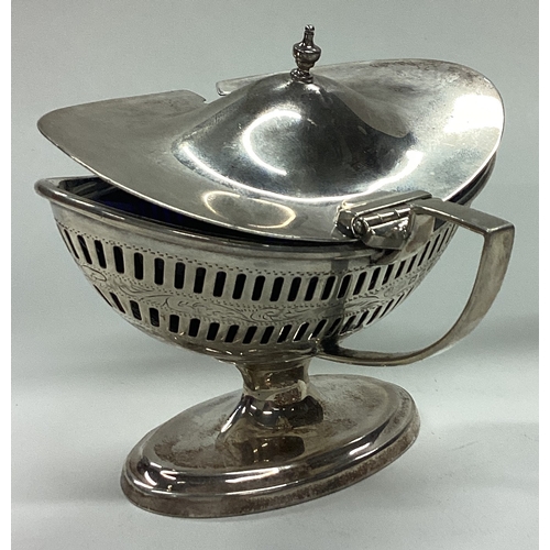 662 - A large pierced silver mustard pot with BGL. London 1937. By IF & Son. Approx. 128 grams of gross we... 