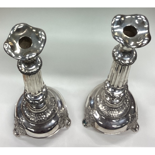 663 - A large pair of Judaica silver candlesticks on feet chased with flowers and vines. Circa 1890. Appro... 