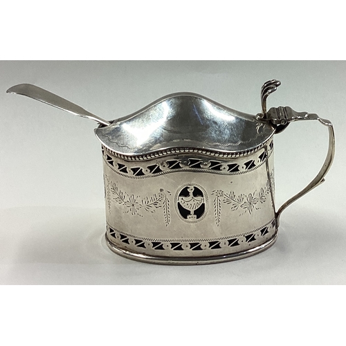 670 - CHESTER: An ornate pierced silver mustard pot with BGL engraved with flowers in the Neoclassical sty... 