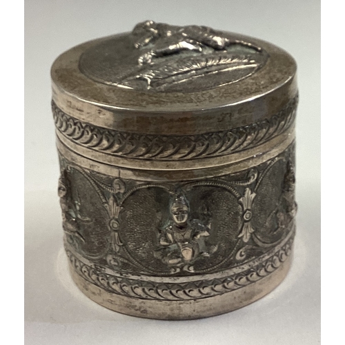 686 - An Antique Thai chased silver snuff box embossed with scenes. Approx. 75 grams. Est. £60 - £80.