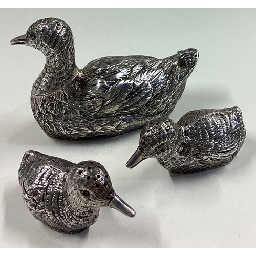 688 - A rare novelty set of three silver pepperettes in the form of ducks with lift-off covers. Fully mark... 