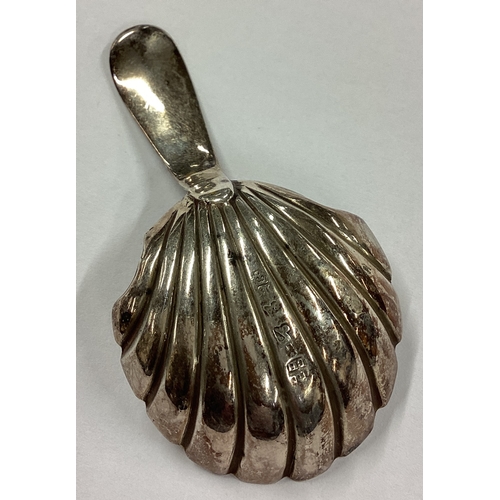 706 - An 18th Century George III silver caddy spoon. Sheffield 1784. Approx. 10 grams. Est. £60 - £80.