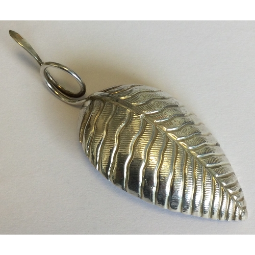 709 - A small textured silver caddy spoon in the form of a leaf. Birmingham. By LI. Approx. 5 grams. Est. ... 