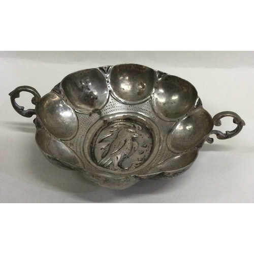 722 - An 18th Century French silver wine taster. Marked to base. Approx. 77 grams. Est. £250 - £300.