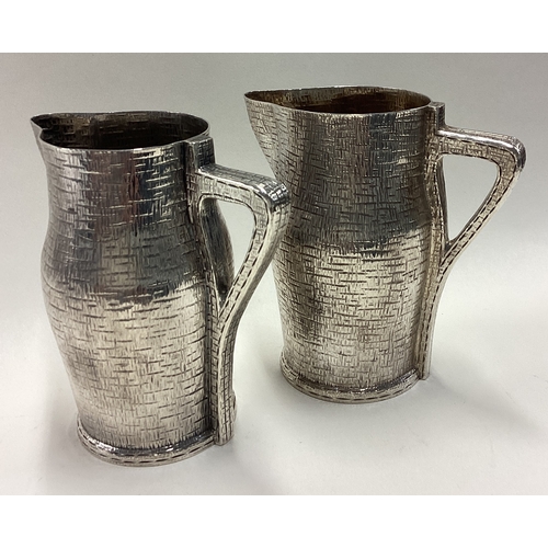 739 - A fine pair of novelty Victorian silver 'blackjack' jugs. London 1887. By William Hutton & Sons. App... 