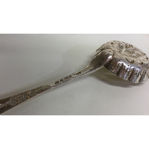 747 - A good quality Victorian cast silver berry ladle with gilded bowl. London. By GA. Approx. 63 grams. ... 