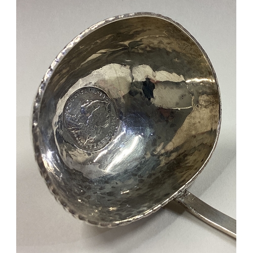 75 - A large 19th Century silver toddy ladle with coin to centre. Approx. 42 grams. Est. £40 - £60.