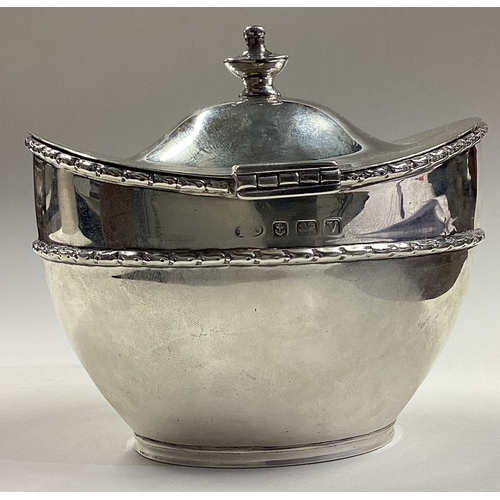 8 - A silver tea caddy / biscuit box with hinged lid. Approx. 182 grams. Est. £150 - £200.